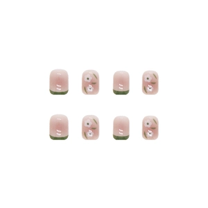 Short round square press-on nails featuring green French tips and white flower designs