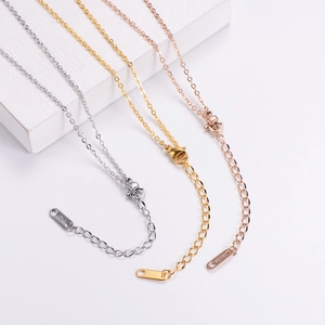 Detailed view of 18K gold plated necklace chains with lobster clasps in three finishes