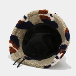 Winter faux shearling bucket hat with beige and brown contrast pattern for outdoors
