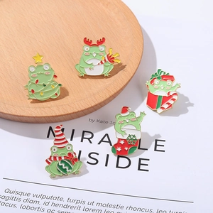 Cute cartoon Christmas frog enamel pins collection in alloy with festive green and red colors