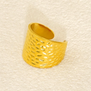 Macro view of gold hammered texture stainless steel ring with vintage adjustable opening