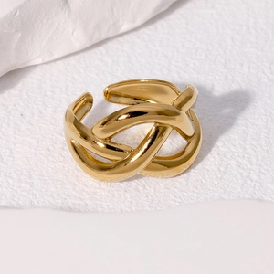 Polished gold twisted knot stainless steel ring shown from a 45-degree angle view