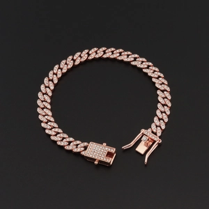 Close-up of 8mm rose gold Cuban link bracelet with sparkling diamond-set crystals