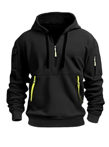 Detail of black tactical hoodie featuring fluorescent green zipper pulls and sleeve pockets