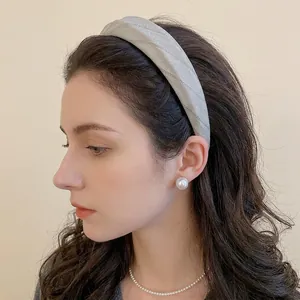 Elegant grey herringbone fabric headband for women with a thick non-slip design and texture