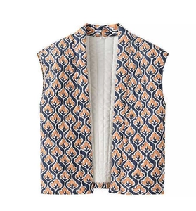 Detailed view of vintage patterned vest with stand collar and white quilted lining