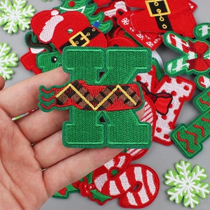 Christmas alphabet K embroidery patch with festive red and green winter holiday patterns