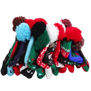 Detail of colorful knitted Christmas hats with pom-poms and LED lights in various patterns