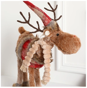 Detail of plush Christmas reindeer with red-white plaid hat and beige knitted scarf
