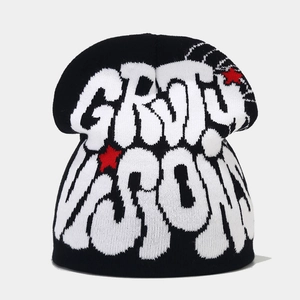 Detail shot of jacquard knit texture with street style graffiti text and red star patterns