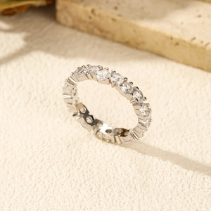 Sparkling S925 sterling silver eternity ring with round clear crystals on stone base