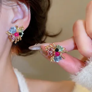 Elegant Monet-style floral stud earrings with colorful enamel flowers and gold base