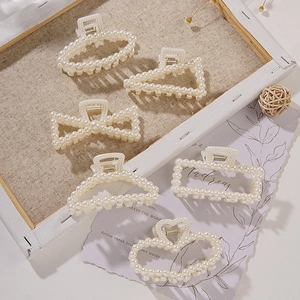 Elegant French pearl hair claw clips set in heart, bow, and geometric shapes