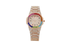 Macro shot of rose gold watch with rainbow crystal bezel and full diamond pavé setting