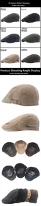 Detail view of cotton newsboy caps showing adjustable buckles and six classic colors