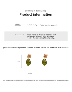 Detailed view of vintage gold metal and green acrylic drop earrings with 4.7cm dimensions