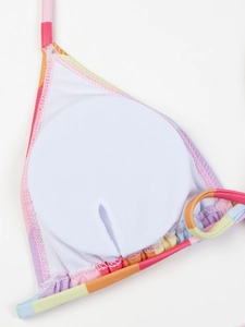 Detail of bikini top interior showing breathable white padding and colorful trim stitching