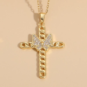 Close-up of a 14K gold plated cross pendant with a zircon butterfly center on a gold chain