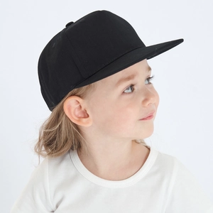 Detailed close-up of a black flat brim kids baseball cap with breathable cotton texture
