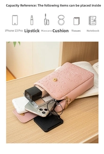 Pink PU leather crossbody phone bag with embossed butterfly and heart patterns on desk