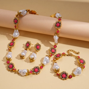 Vintage gold jewelry set with Baroque pearls, pink gemstones and floral diamond accents