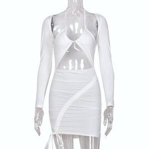 Detail of white cutout long sleeve dress with halter neck drawstring and ruching texture