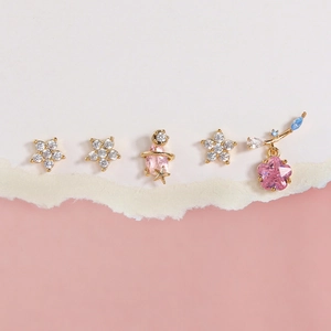 5-piece gold earrings set with star motifs, cherry blossom designs and pink zircon gems
