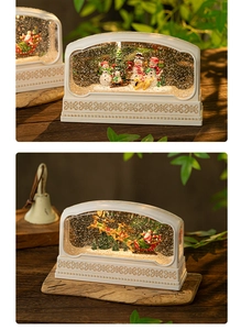 Detail of vintage Christmas snow globe lantern with snowman and Santa scenes