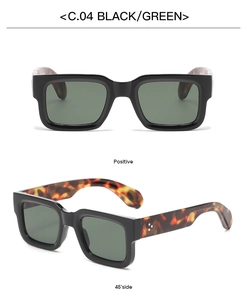 Detail view of square thick frame sunglasses with green lenses and tortoiseshell temples