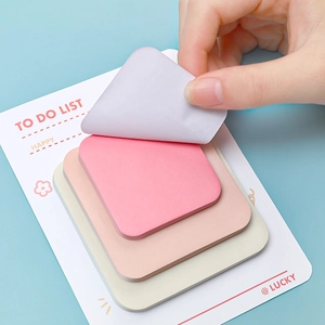 Sticky notes set in pastel colors with a hand peeling a note from the backboard