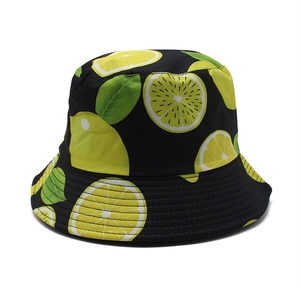 Black bucket hat featuring vibrant yellow lemon prints and green leaves for summer sun wear