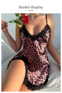 Detail of pink leopard print satin nightgown featuring black eyelash lace and V-neckline