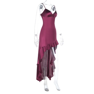 Detailed view of wine red satin evening dress with asymmetrical ruffled hemline