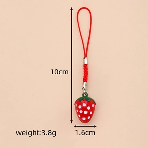 Detailed view of red strawberry charm phone strap with size and weight measurements