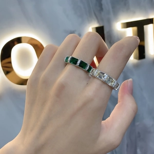 Elegant emerald and yellow gemstone S925 sterling silver eternity rings shown on model