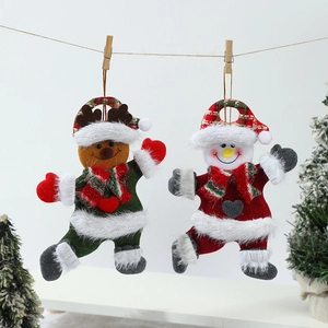 Plush Christmas reindeer and snowman hanging ornaments on rope with festive trees