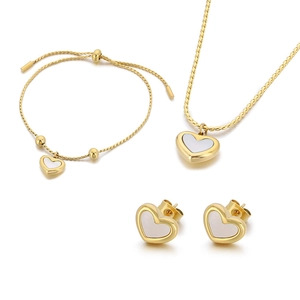 Golden shell heart jewelry set featuring necklace bracelet and earrings on white background
