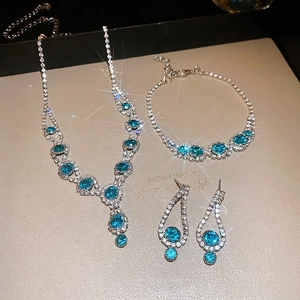 Luxurious silver jewelry set with ocean blue crystals including necklace and earrings