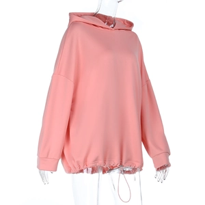 Detail of pink hoodie featuring drop shoulder design and adjustable drawstring hemline