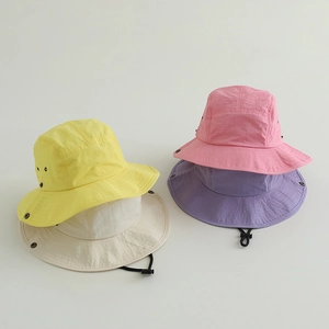 Detail of colorful quick-dry sun hats with adjustable drawstrings and wide brims