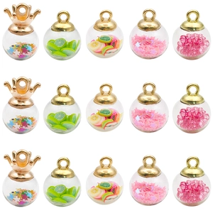 Miniature glass bottle pendants with gold crown caps and colorful star sequin fillings