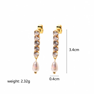 Detail of 18K gold plated steel drop earrings with clear zircon and white pearl dangle