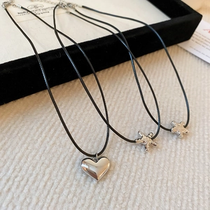 Minimalist silver heart and star pendant necklace set with elegant black cord strap