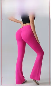Detail of rose pink high-waist yoga flare pants showing the ruched butt lifting design