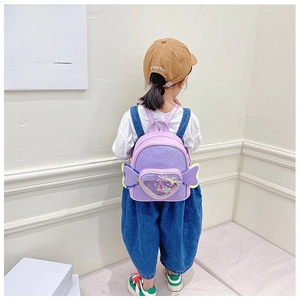 Detail of purple glitter toddler backpack with fairy wings and transparent heart pocket