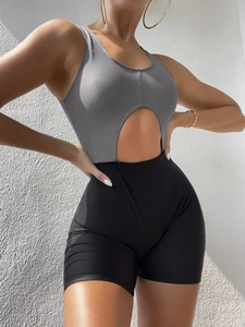 Women's two-tone cutout bodysuit with grey tank top and black shorts for fitness yoga
