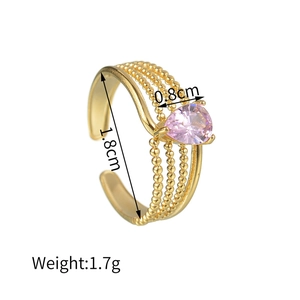 Detail of 18K gold-plated braided beaded ring with pink pear-cut zircon stone