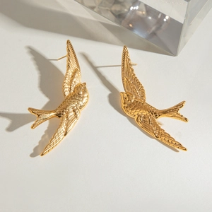 Vintage stainless steel swallow bird earrings in gold finish with feather details