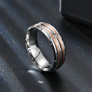 Macro shot of titanium steel ring with rose gold brushed finish and inlaid zircon stone