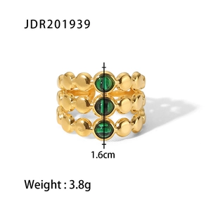 Detail view of 18K gold ring with three green stones showing 1.6cm height and 3.8g weight